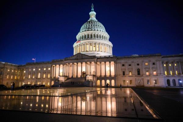 The U.S. Capitol is seen at dusk as the House meets to vote on a rules package for the 118th Congress, in Washington, DC, on January 9, 2023. The US Congress passed an 11th-hour funding bill September 30, 2023 to keep federal agencies running for another 45 days and avert a costly government shutdown -- although the deal left out aid to war-torn Ukraine requested by President Joe Biden.