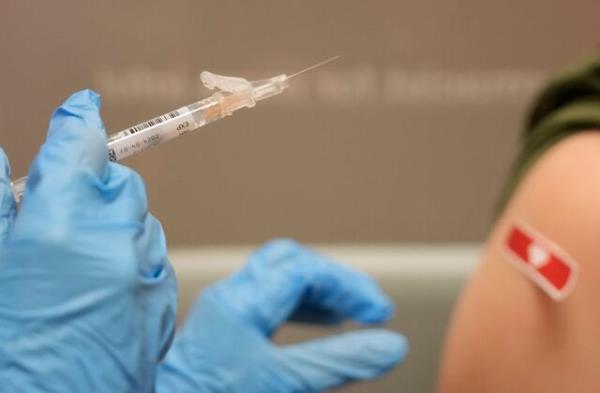 CYPRESS, TEXAS - SEPTEMBER 20: Kim Nguyen, pharmacist, prepares to give a Moderna Spikevax COVID-19 vaccine at CVS, 12550 Louetta Rd., Wednesday, Sept. 20, 2023, in Cypress. (Melissa Phillip/Houston Chronicle via Getty Images)