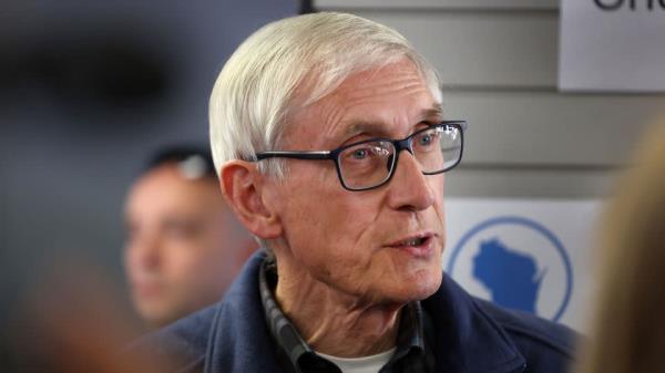 Wisconsin Gov. Tony Evers speaks to reporter on November 7, 2022, in Milwaukee. - Scott Olson/Getty Images