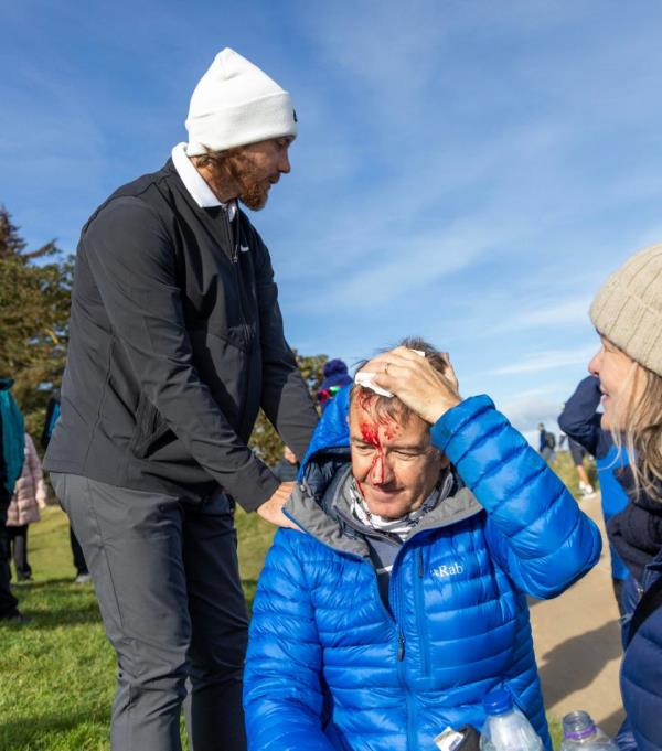 Tommy Fleetwood speaks to Andrew Summerskill after hitting him with a wayward shot - Tommy Fleetwood apologises after fan left bloodied at Dunhill links Championship