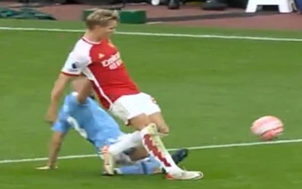 Martin Odegaard is caught late by Mateo Kovacic