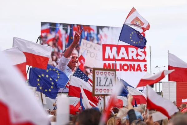 A picture of Do<em></em>nald Tusk, the leader of the Civic Platform party (PO), is screened during the so-called Million Hearts March organized by his party in Warsaw, Poland on Oct. 1, 2023. (Photo by Beata Zawrzel/NurPhoto via Getty Images)
