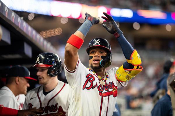 ATLANTA, GA - SEPTEMBER 26: Ronald Acuna Jr. #13 of the Atlanta Braves celebrates after hitting a home run during the seventh inning against the Chicago Cubs at Truist Park on September 26, 2023 in Atlanta, Georgia. (Photo by Kevin D. Liles/Atlanta Braves/Getty Images)