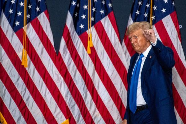 Former US President and 2024 Republican presidential hopeful Donald Trump walks off stage after speaking at a campaign rally at the New England Sports Center in Derry, New Hampshire, October 23, 2023. Trump filed paperwork to take part in The New Hampshire primary earlier in the day.