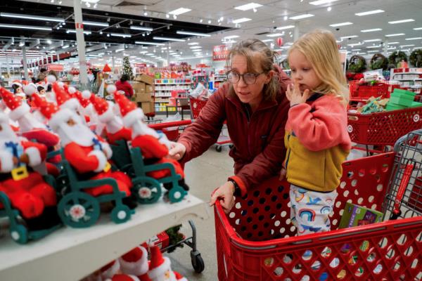 Margaret Sietsema and her daughter Azalea Sietsema shop at a Target store ahead of the Thanksgiving holiday and traditional Black Friday sales in Chicago, Illinois, U.S. November 21, 2023. REUTERS/Vincent Alban