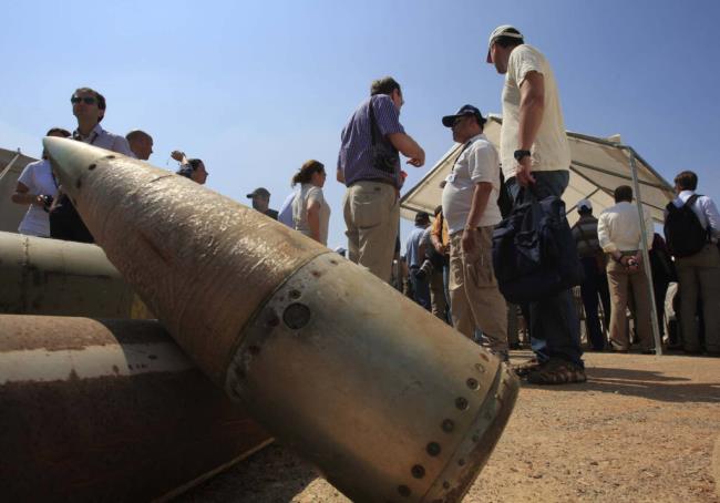 FILE - Activists and internatio<em></em>nal delegations stand next to cluster bomb units, during a visit to a Lebanese military ba<em></em>se at the opening of the Second Meeting of States Parties to the Co<em></em>nvention on Cluster Munitions, in the southern town of Nabatiyeh, Lebanon, Sept. 12, 2011. The Biden administration has decided to provide cluster munitions to Ukraine and is expected to announce on Friday, July 6, 2023, that the Pentagon will send thousands as part of the latest military aid package for the war effort against Russia, according to people familiar with the decision. (AP Photo/Mohammed Zaatari, File)